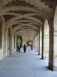Under the arcades, Place des Vosges, Paris